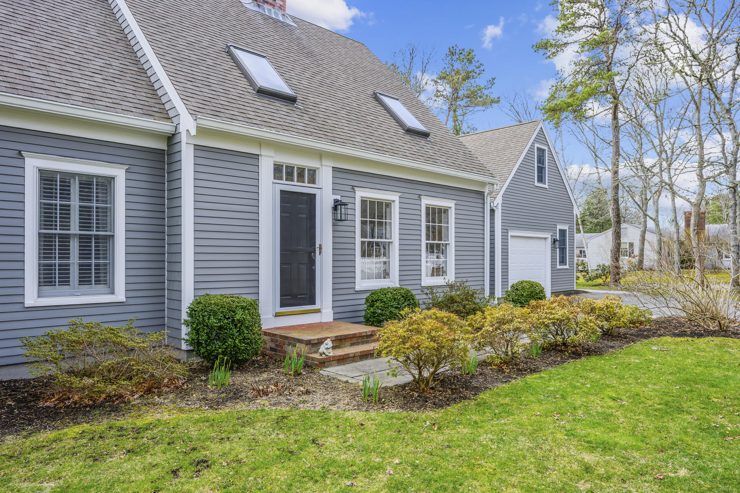 83 Cemetery Road Harwich, MA 02645 - Photo 4 of 53 a front view of a house with garden