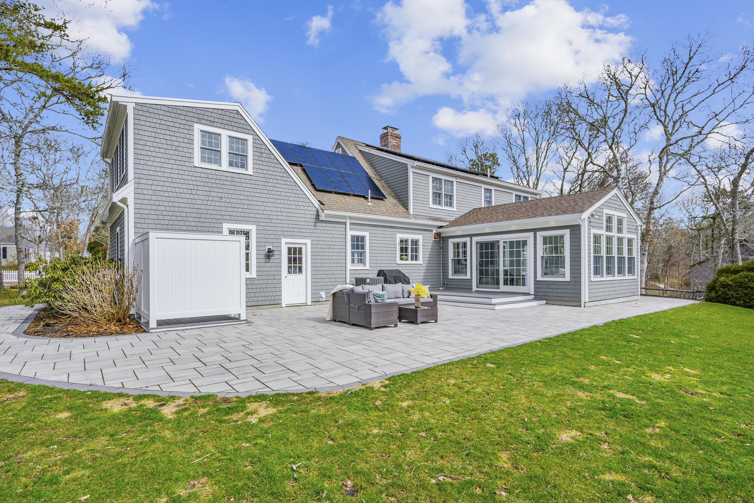 83 Cemetery Road Harwich, MA 02645 - Photo 43 of 53 a view of a house with a patio