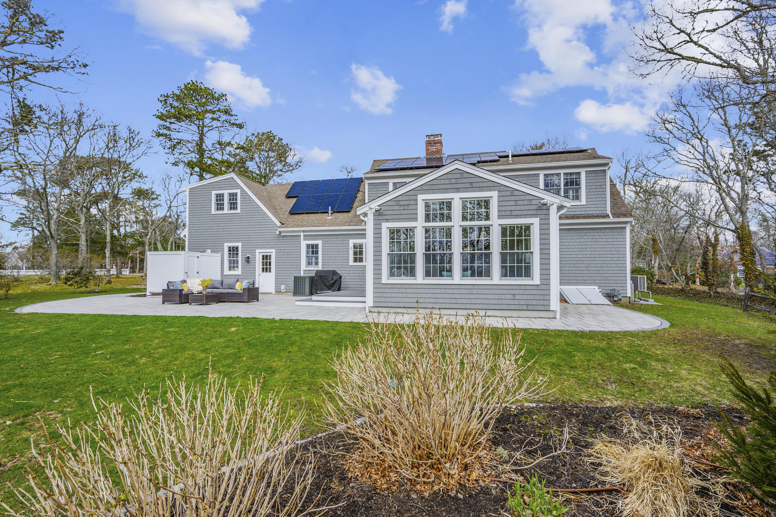 83 Cemetery Road Harwich, MA 02645 - Photo 45 of 53 a front view of a house with a garden