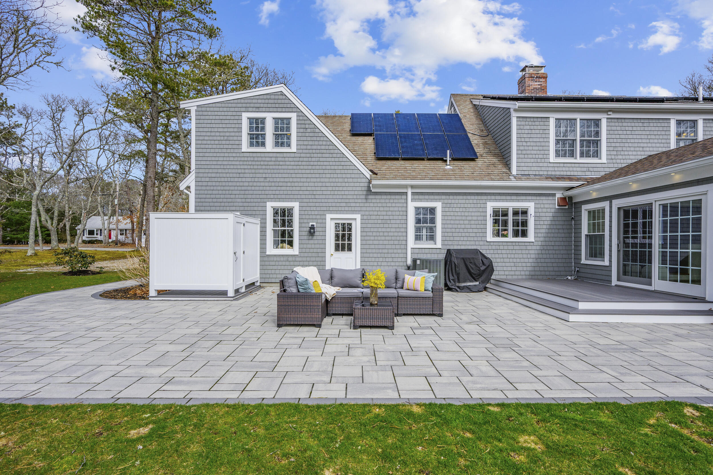 83 Cemetery Road Harwich, MA 02645 - Photo 48 of 53 a backyard of a house with seating space