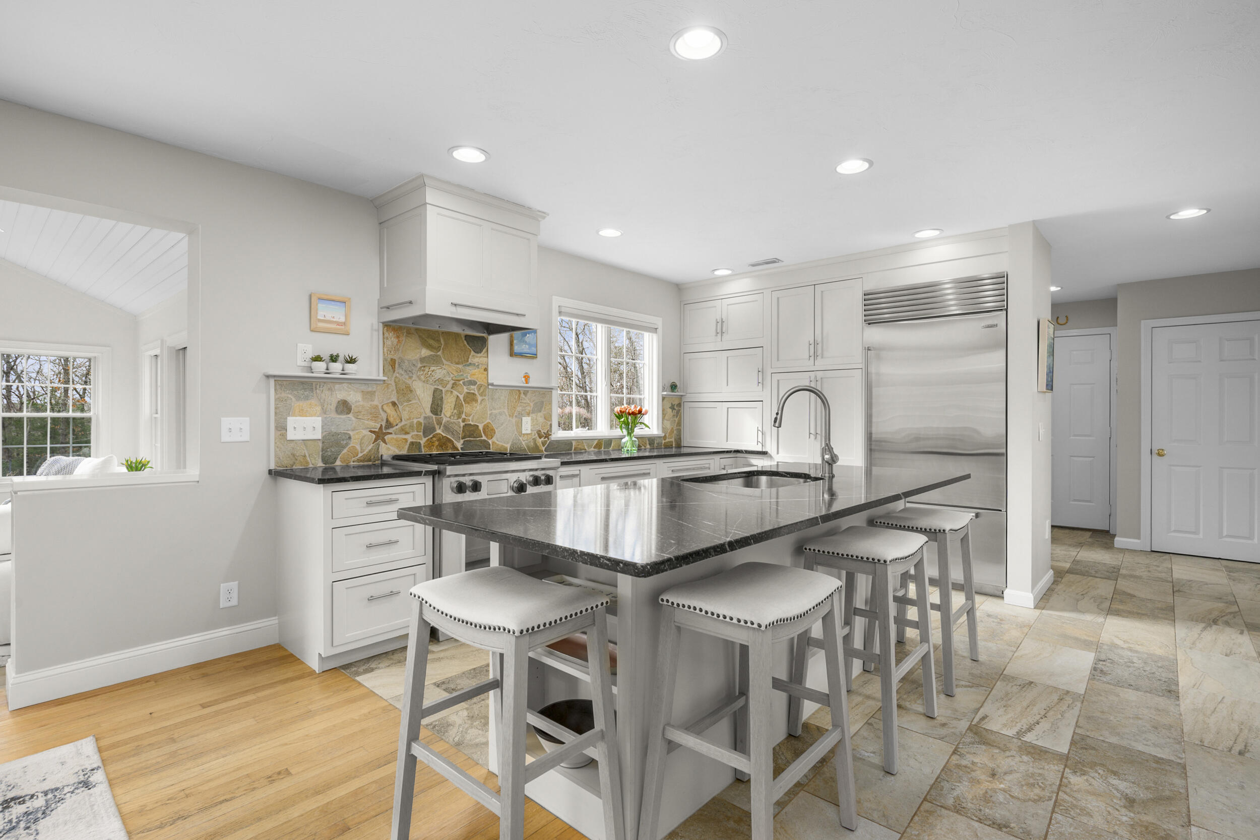 83 Cemetery Road Harwich, MA 02645 - Photo 7 of 53 a kitchen with stainless steel appliances kitchen island granite countertop a sink and cabinets