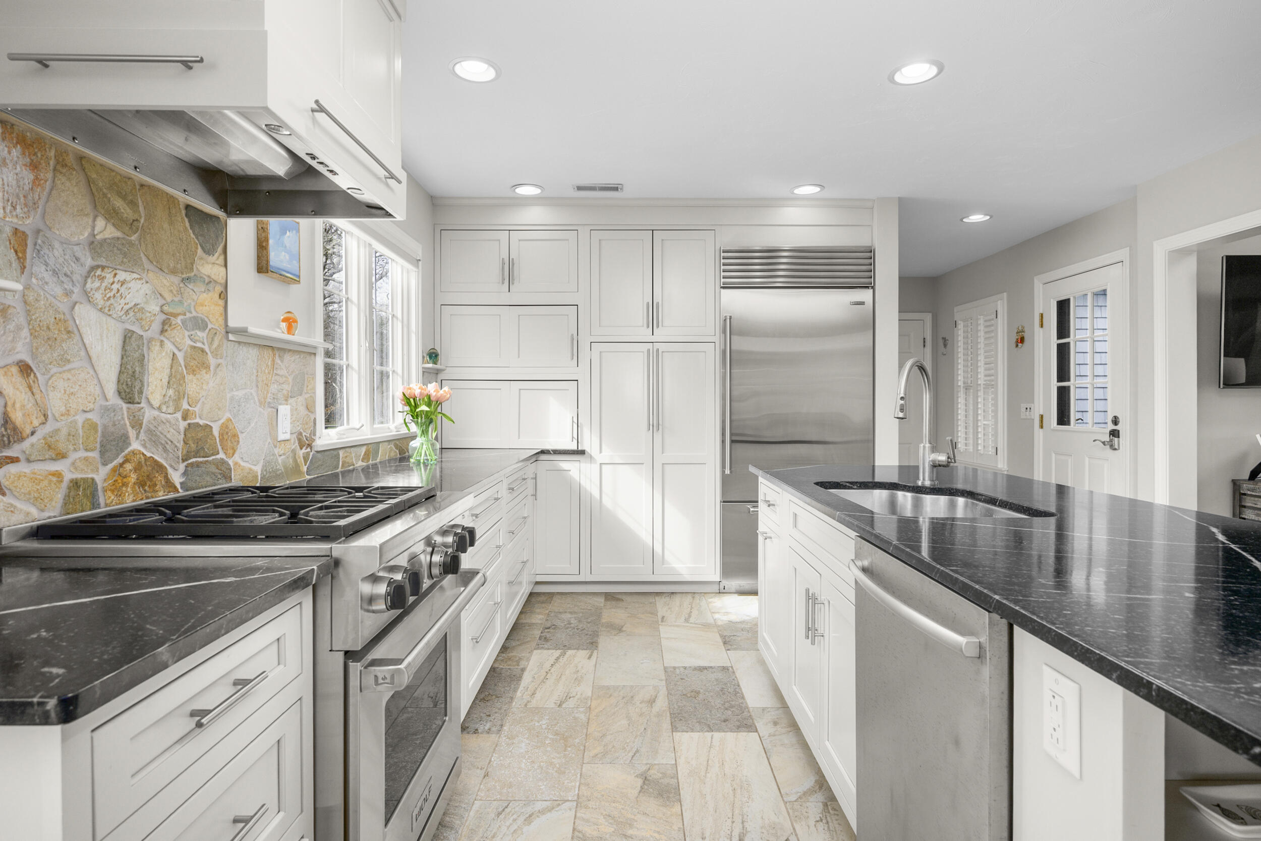 83 Cemetery Road Harwich, MA 02645 - Photo 8 of 53 a kitchen with stainless steel appliances granite countertop a stove and a sink