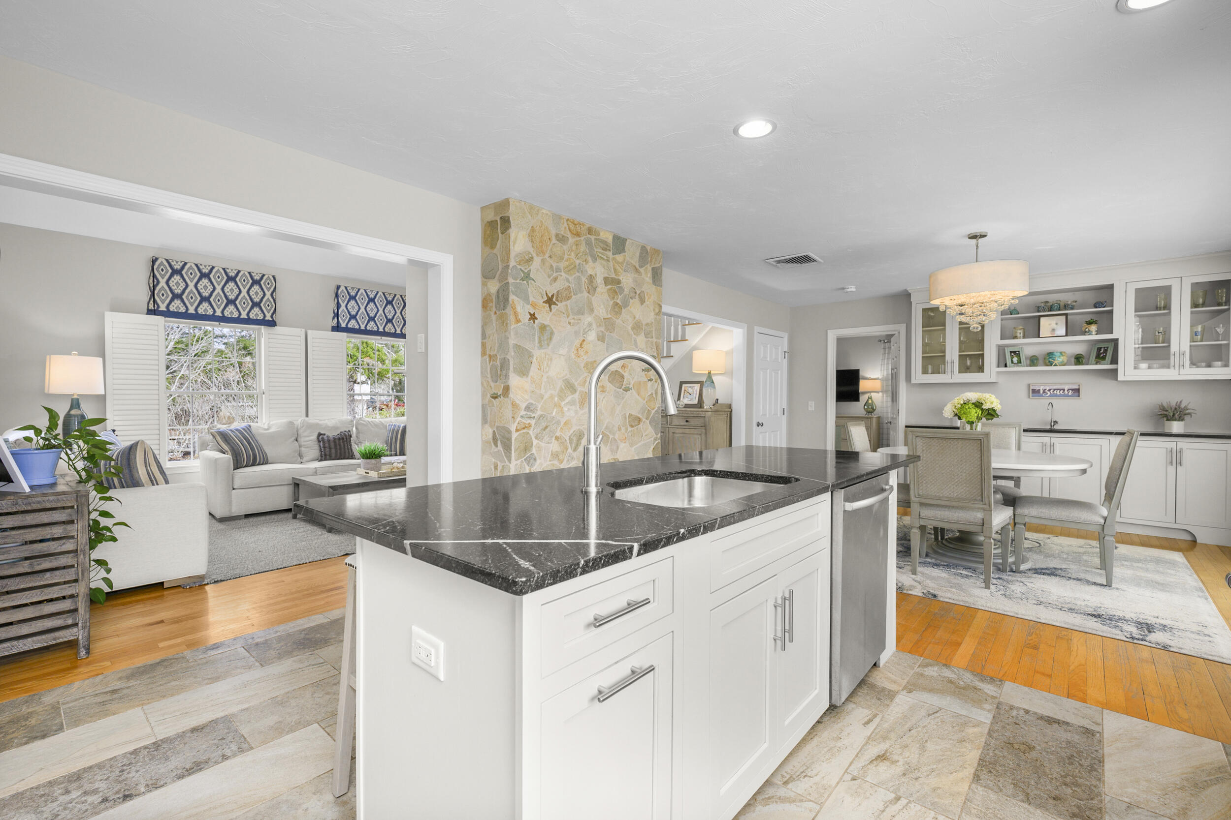 83 Cemetery Road Harwich, MA 02645 - Photo 10 of 53 a kitchen with stainless steel appliances granite countertop a sink and a counter top space