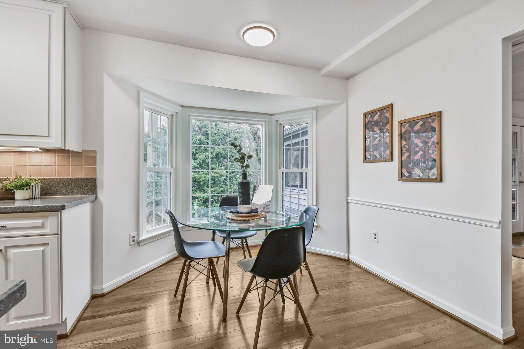 309 Notley Court Silver Spring, MD 20905 - Photo 8 of 32 a view of a dining room with furniture window and wooden floor