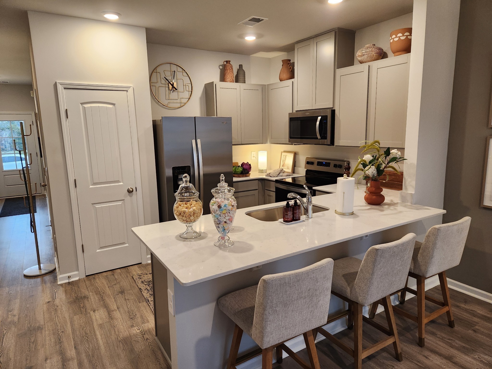 3064 Flyaway Lane Lebanon, TN 37090 - Photo 9 of 29 a kitchen with stainless steel appliances granite countertop a table chairs stove and refrigerator