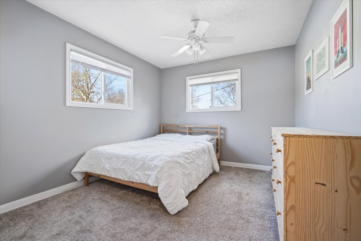 206 North Grove Street Normal, IL 61761 - Photo 16 of 24 a bed room with a bed and a painting