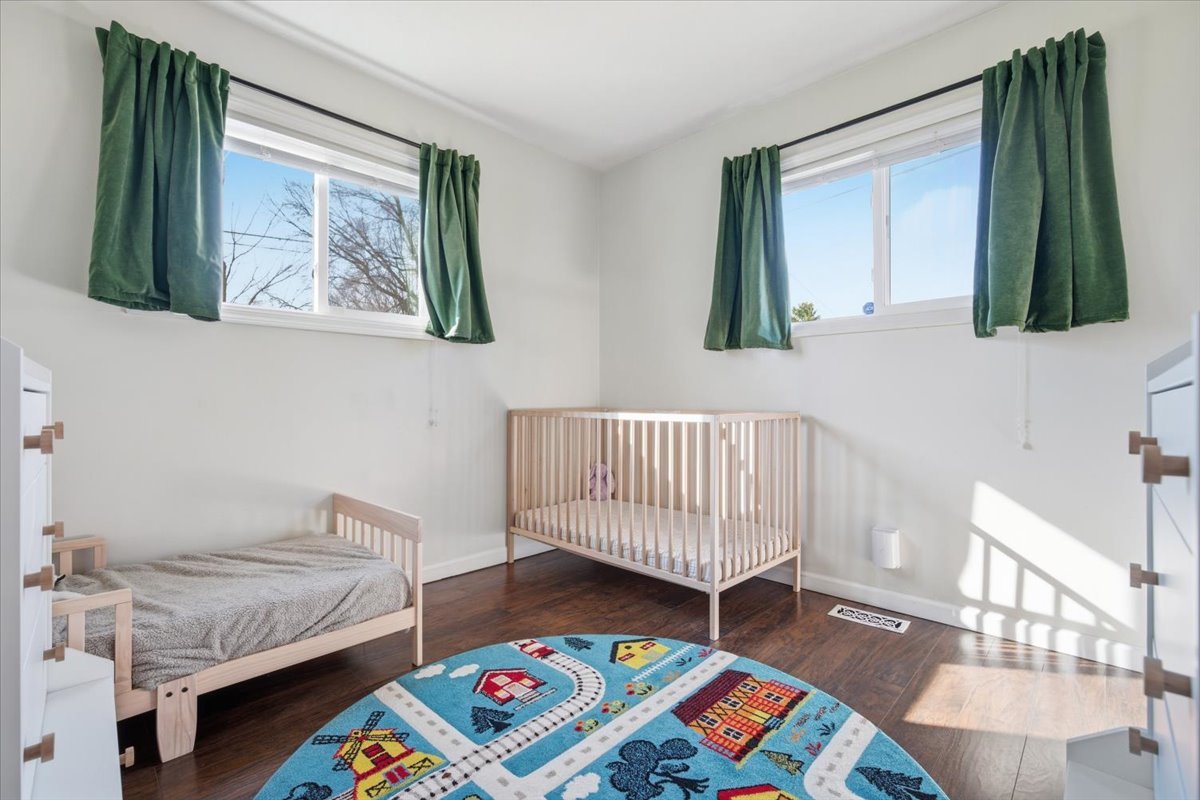 206 North Grove Street Normal, IL 61761 - Photo 18 of 24 a bedroom with a bed and wooden floor