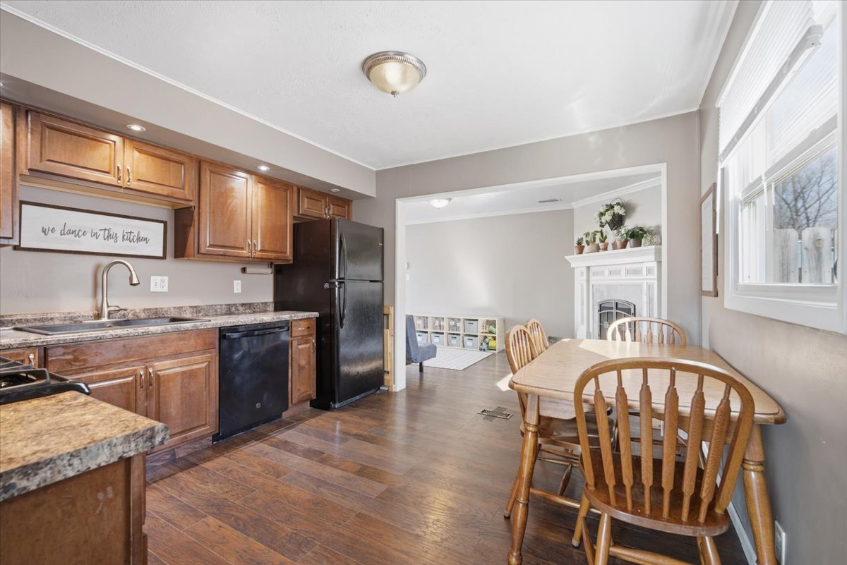 206 North Grove Street Normal, IL 61761 - Photo 8 of 24 a kitchen with stainless steel appliances granite countertop a kitchen island hardwood floor sink stove dining table and chairs