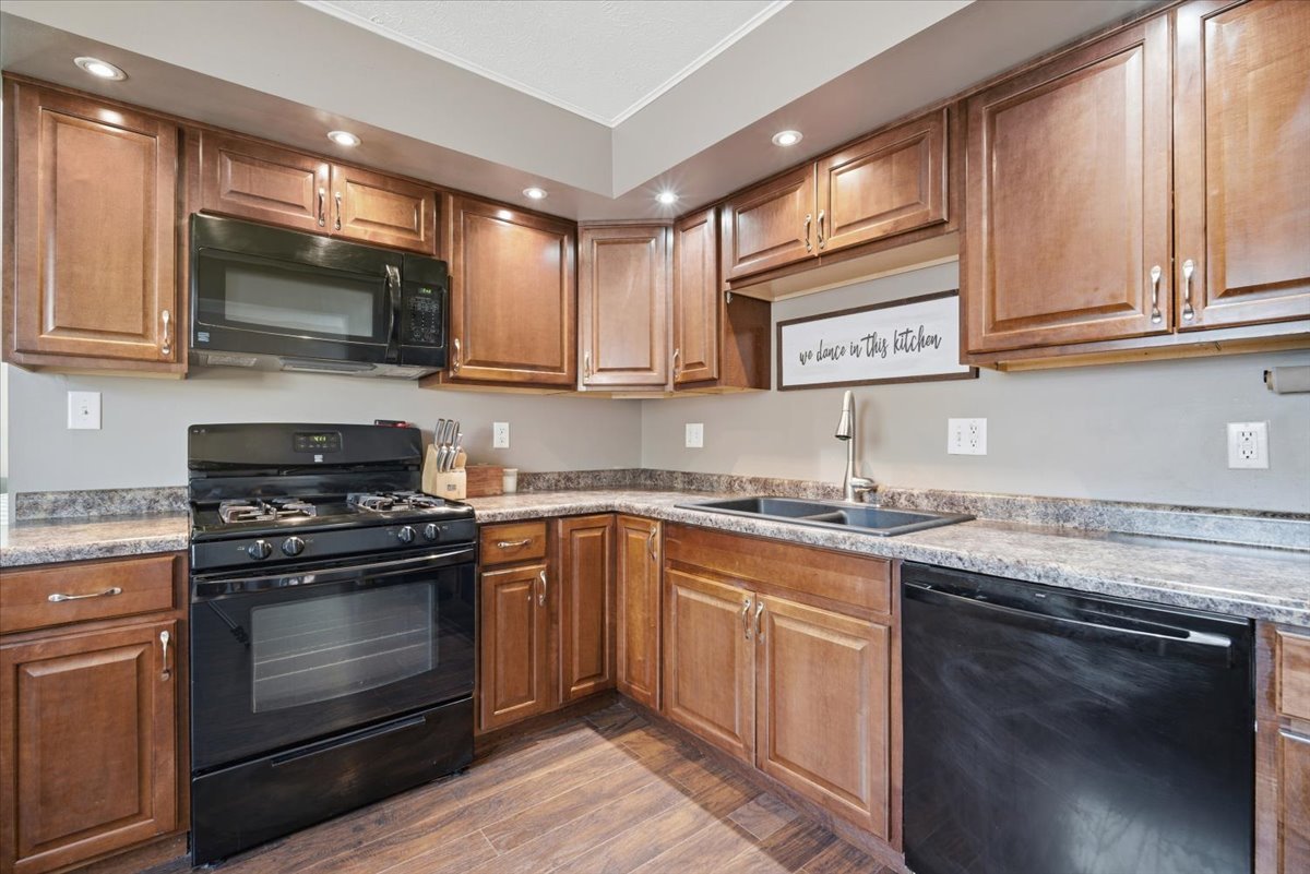 206 North Grove Street Normal, IL 61761 - Photo 10 of 24 a kitchen with stainless steel appliances granite countertop a stove and a microwave