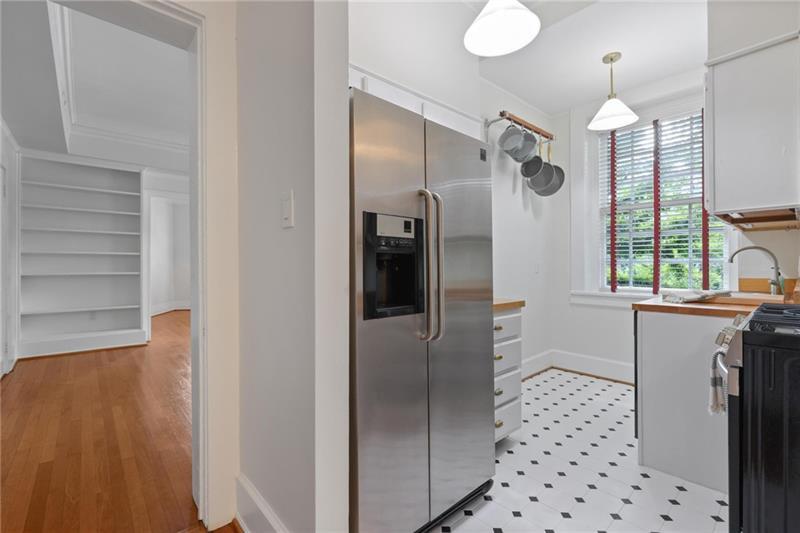 1 South Prado Northeast, Unit 1 Atlanta, GA 30309 - Photo 11 of 21 a kitchen with stainless steel appliances a refrigerator and a sink
