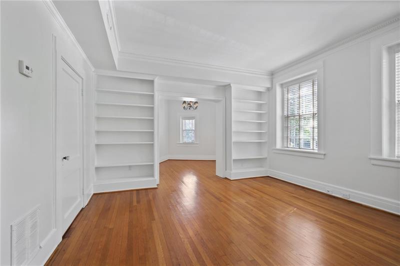 1 South Prado Northeast, Unit 1 Atlanta, GA 30309 - Photo 7 of 21 a view of empty room with wooden floor and fan