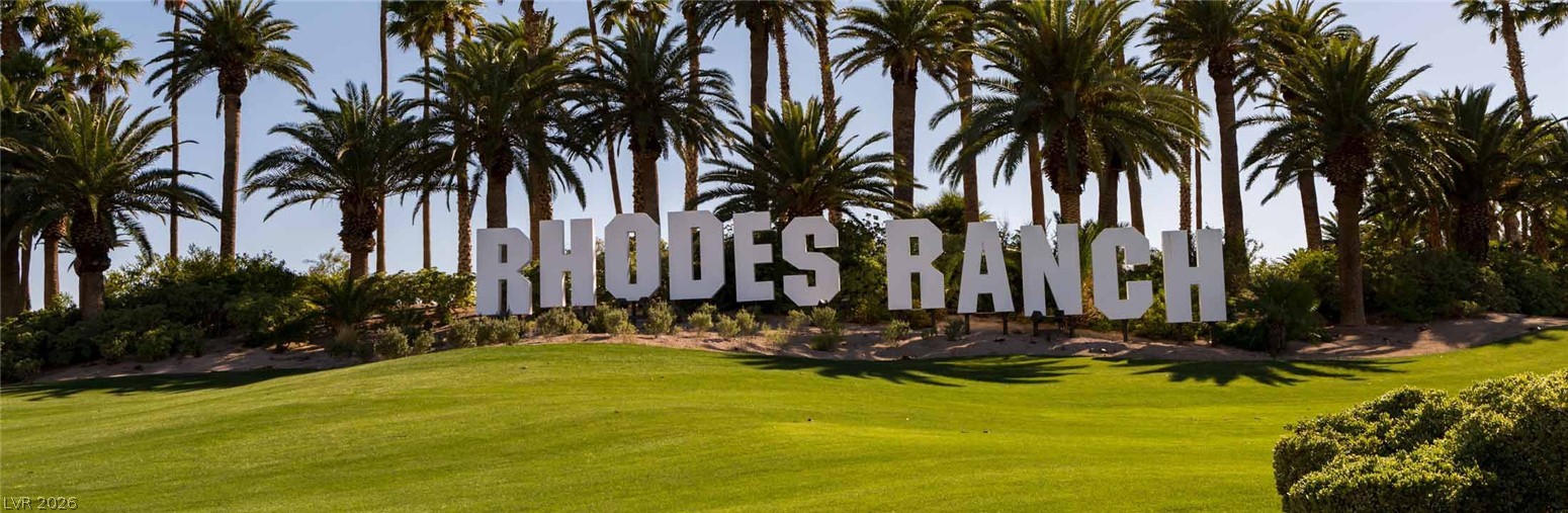 87 Tall Ruff Drive Las Vegas, NV 89148 - Photo 26 of 71 Rhodes Ranch welcomes you with lush green landscaping and towering palms.
