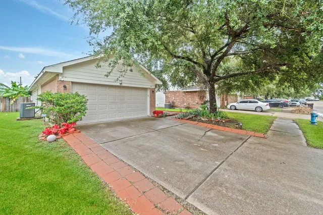 a view of a garden with flowers and trees