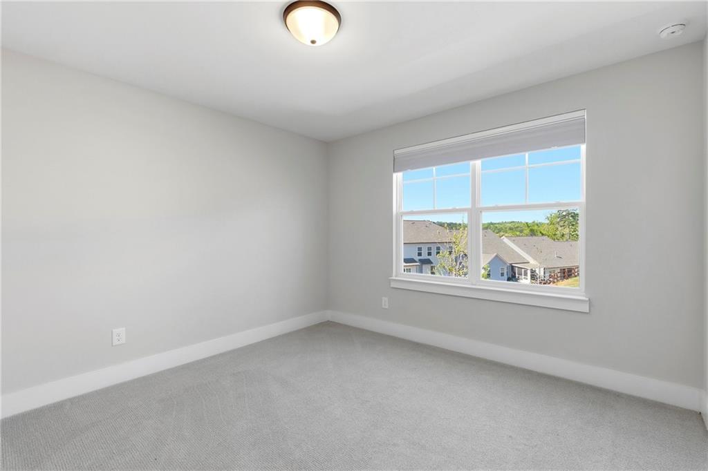 203 Sunshower Ridge Canton, GA 30114 - Photo 28 of 58 an empty room with windows