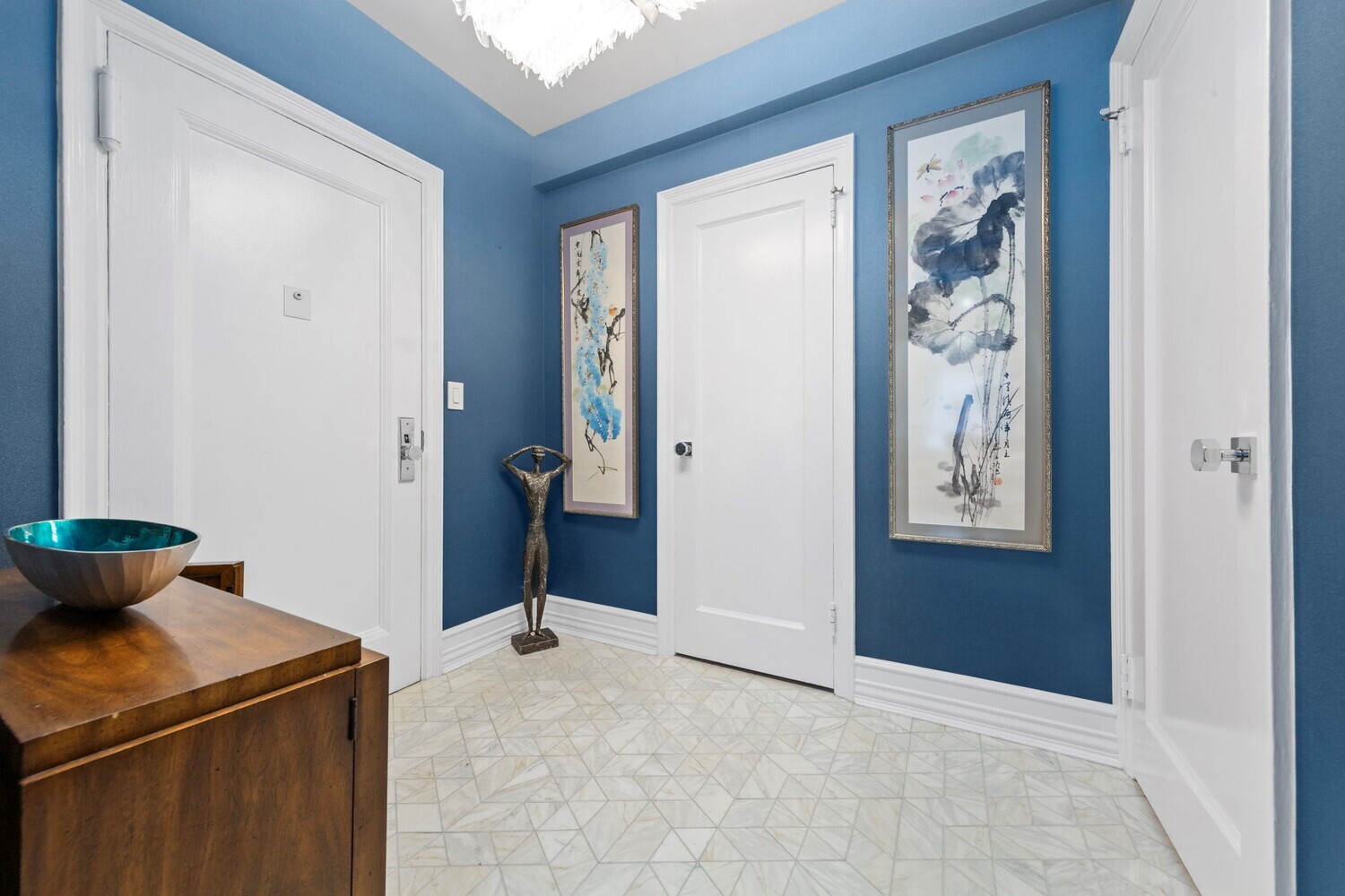 400 East 52nd Street, Unit 7J Manhattan, NY 10022 - Photo 6 of 9 wooden floor and utility room with closet