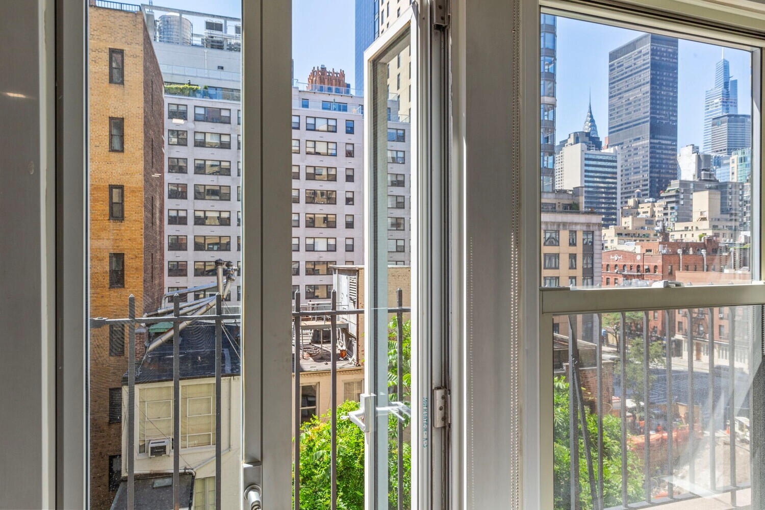 400 East 52nd Street, Unit 7J Manhattan, NY 10022 - Photo 7 of 9 a view of a balcony with a floor to ceiling windows