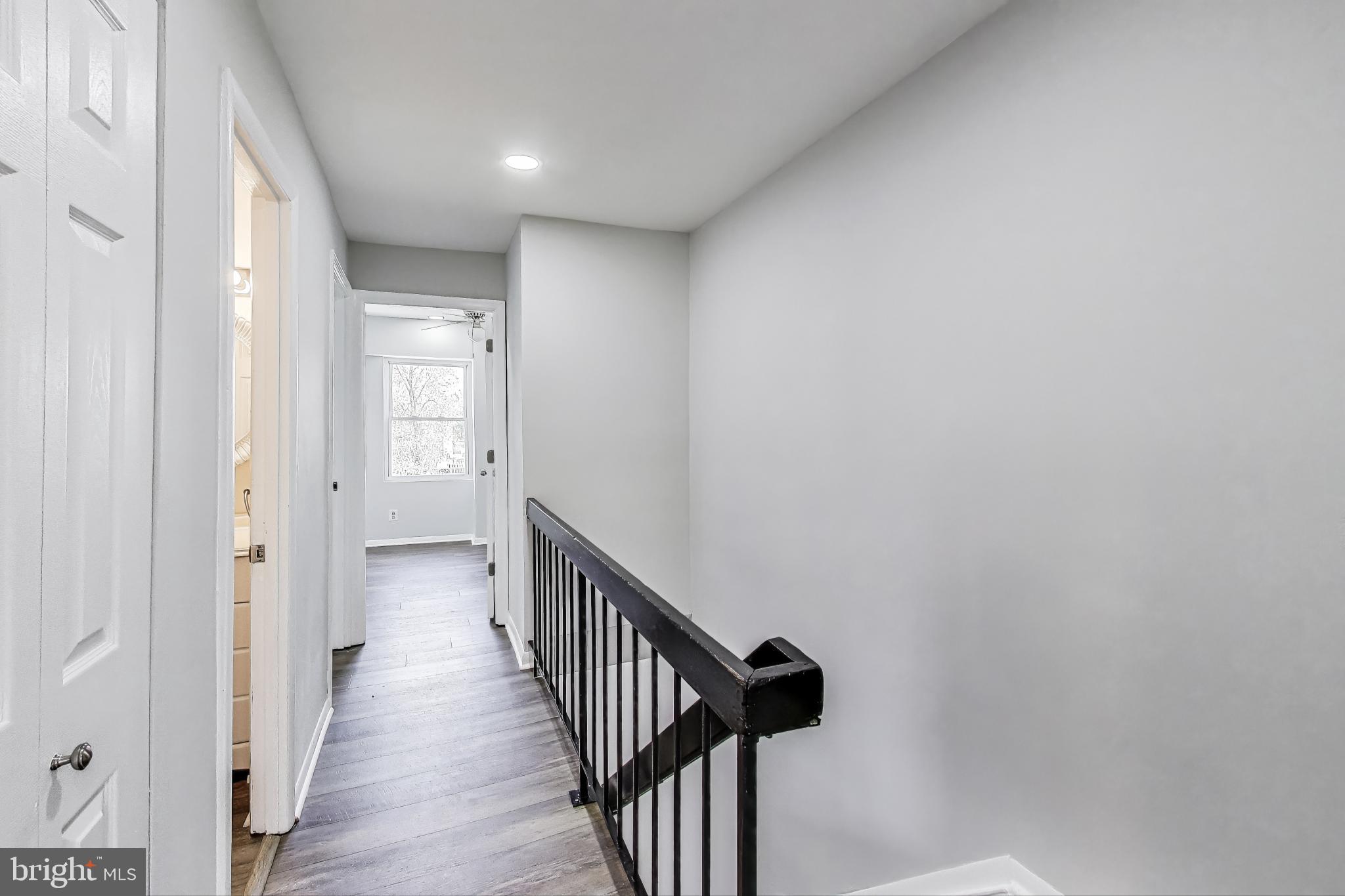 17520 Hoskinson Road Poolesville, MD 20837 - Photo 12 of 31 a view of a hallway with wooden floor and entryway