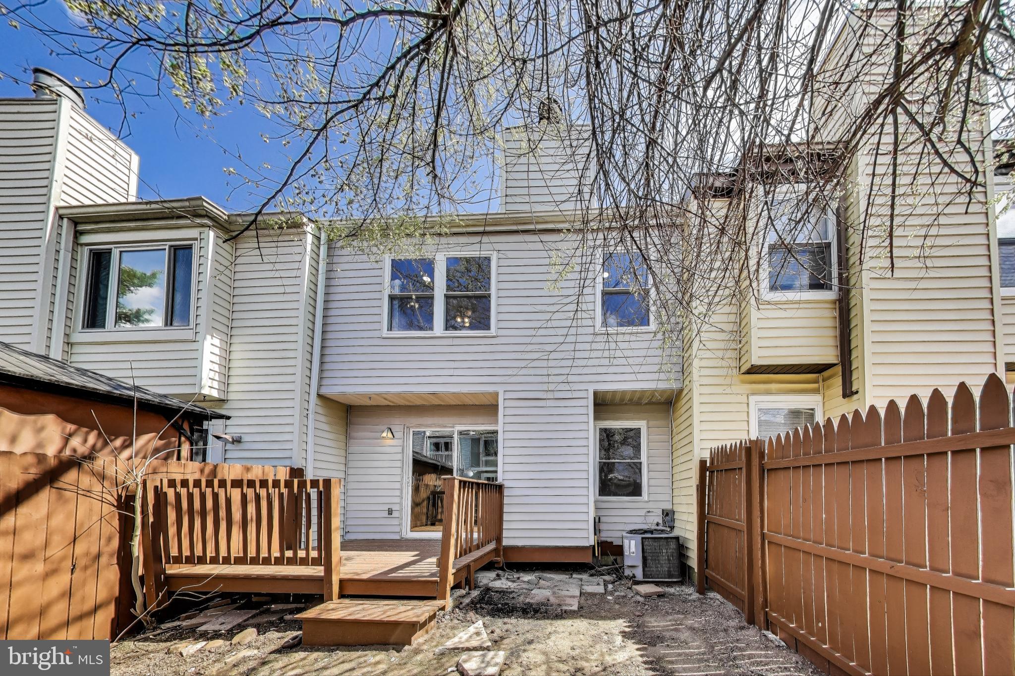 17520 Hoskinson Road Poolesville, MD 20837 - Photo 25 of 31 a front view of a house with a bench