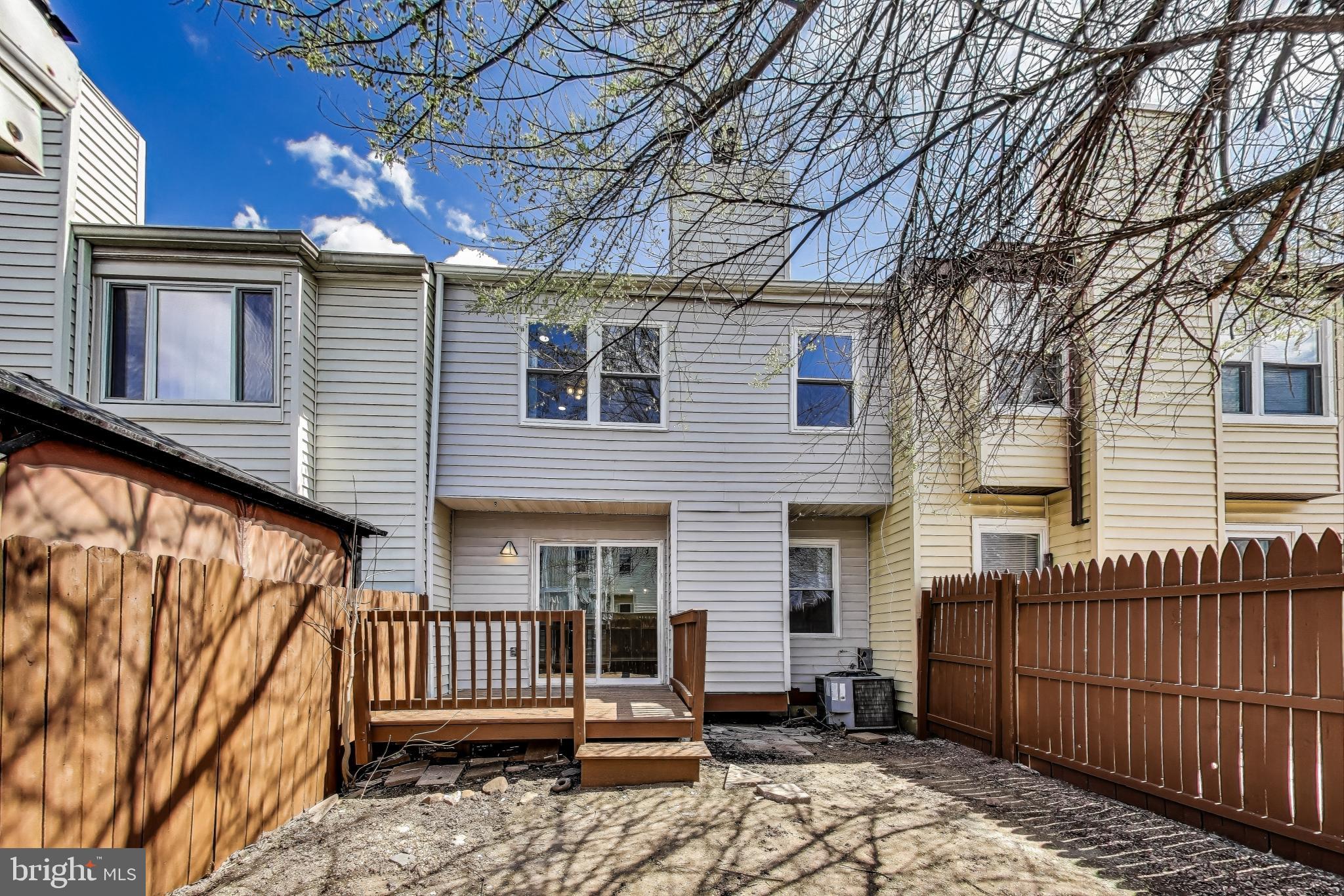 17520 Hoskinson Road Poolesville, MD 20837 - Photo 26 of 31 a view of a house with a small yard and wooden floor and fence