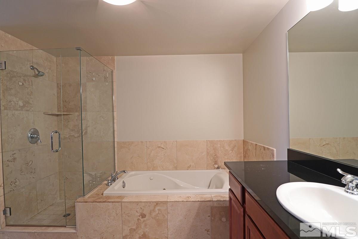 50 North Sierra Street, Unit 706 Reno, NV 89501 - Photo 7 of 24 a bathroom with a sink toilet and shower