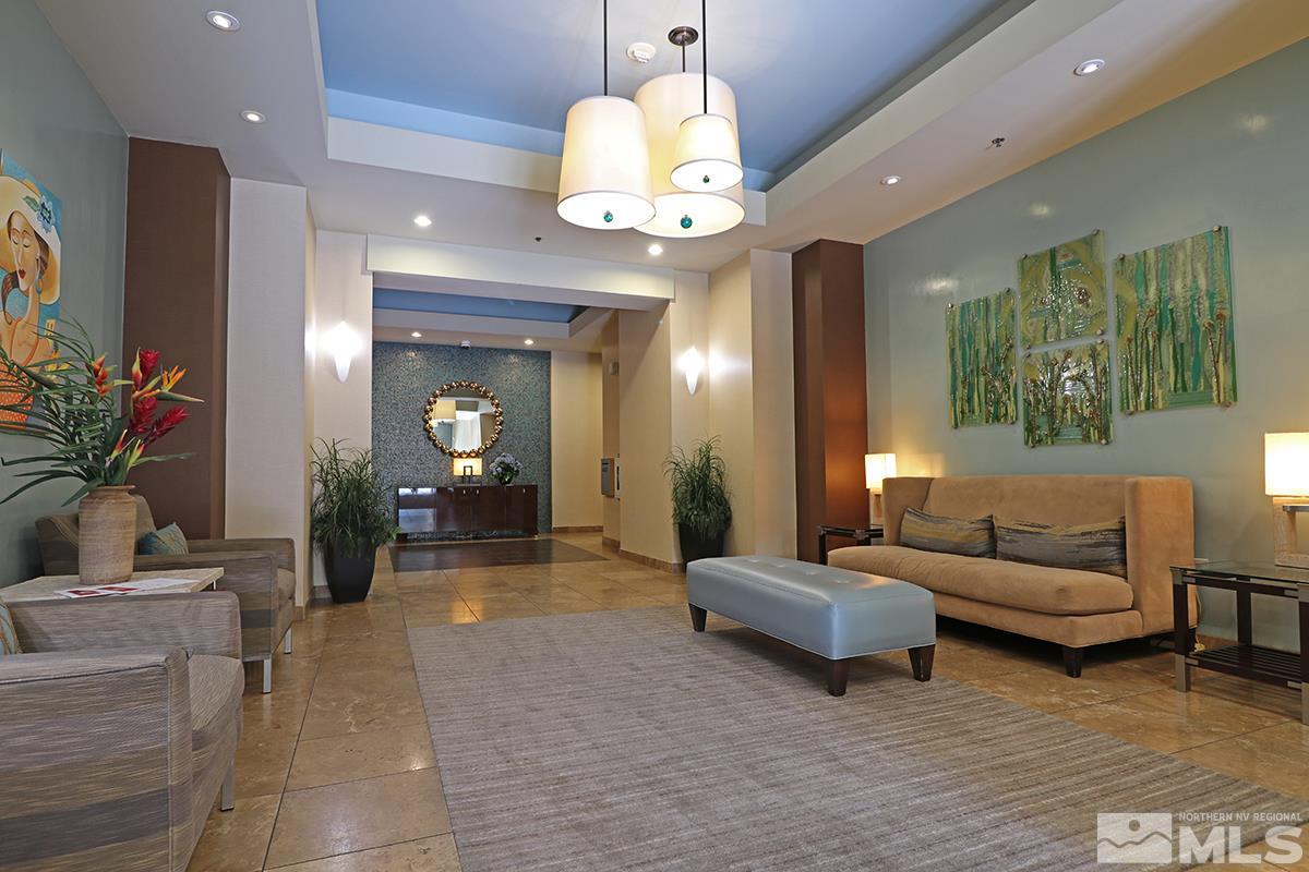50 North Sierra Street, Unit 706 Reno, NV 89501 - Photo 10 of 24 a living room with furniture and a chandelier