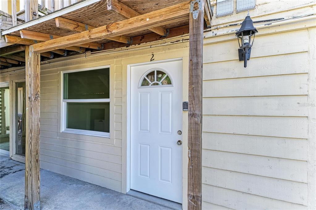 101 73rd Street, Unit 2 Holmes Beach, FL 34217 - Photo 11 of 55 a view of front door of house