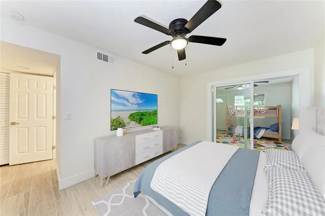 a living room with furniture and flat screen tv