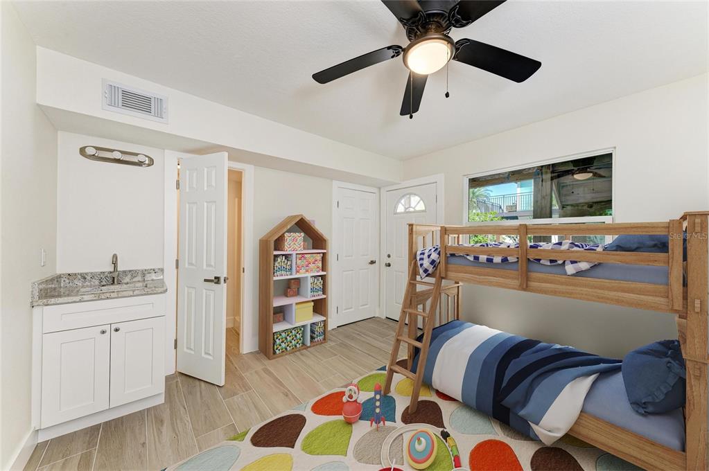 101 73rd Street, Unit 2 Holmes Beach, FL 34217 - Photo 15 of 55 a living room with furniture and flat screen tv