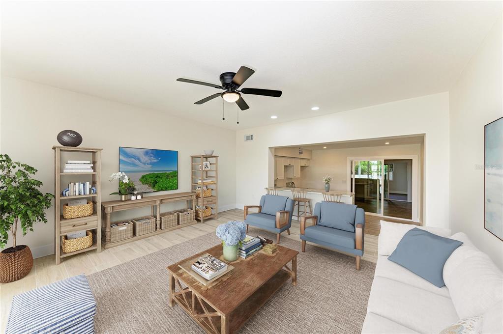101 73rd Street, Unit 2 Holmes Beach, FL 34217 - Photo 19 of 55 a living room with furniture and a flat screen tv