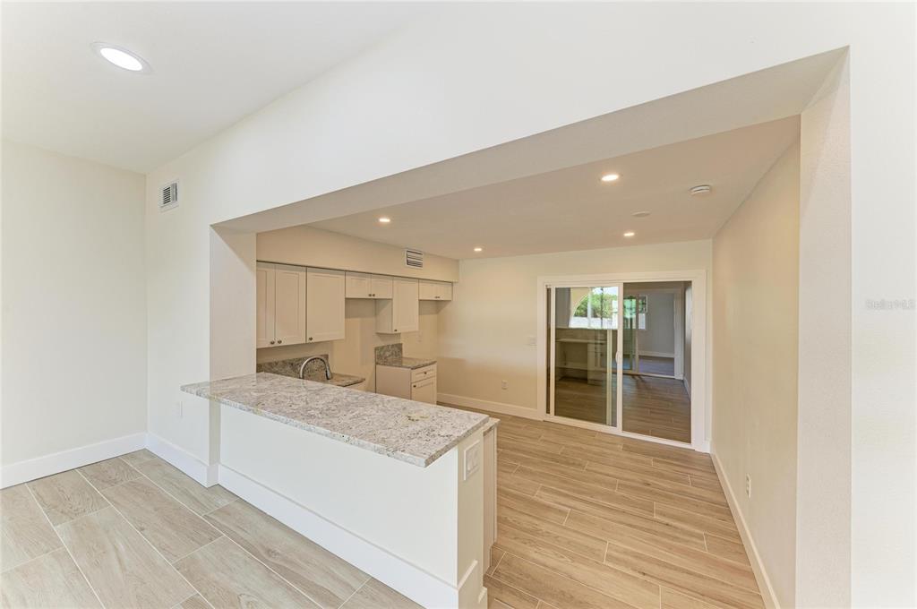 101 73rd Street, Unit 2 Holmes Beach, FL 34217 - Photo 23 of 55 a view of kitchen island wooden floor