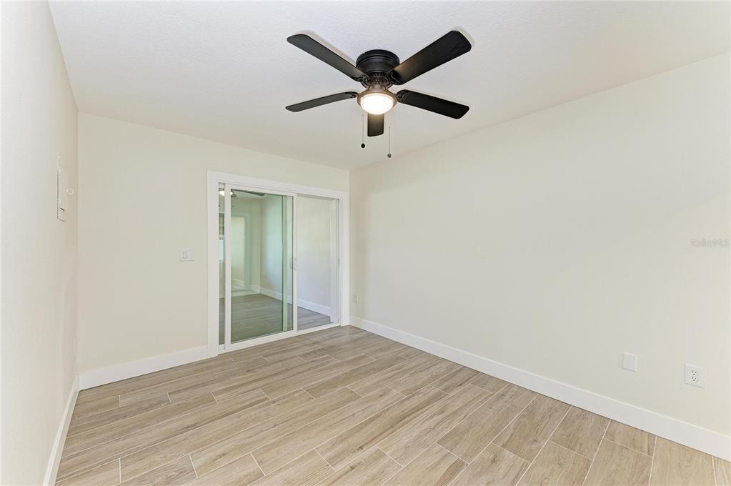 101 73rd Street, Unit 2 Holmes Beach, FL 34217 - Photo 29 of 54 a view of empty room with wooden floor