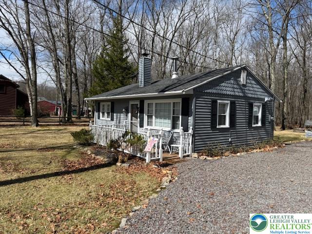 192 Cartwright Road Blakeslee, PA 18610 - Photo 1 of 20 a front view of a house with garden