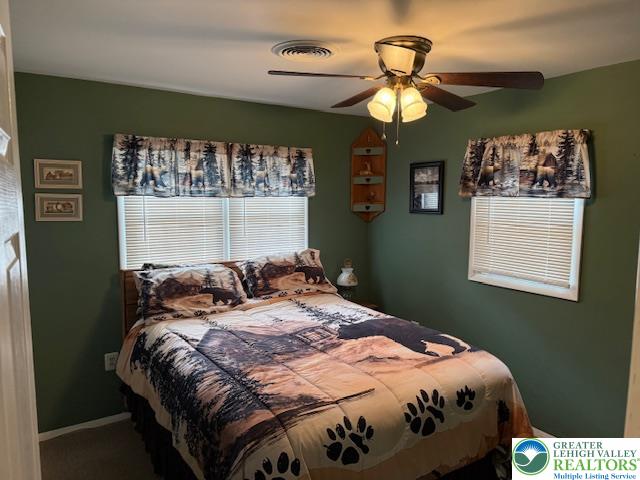 192 Cartwright Road Blakeslee, PA 18610 - Photo 15 of 20 a bedroom with a bed and a chandelier