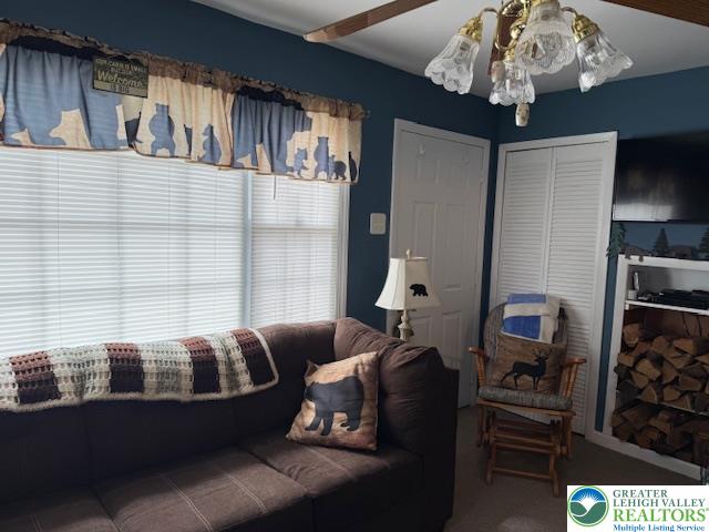 192 Cartwright Road Blakeslee, PA 18610 - Photo 8 of 20 a living room with furniture and a chandelier