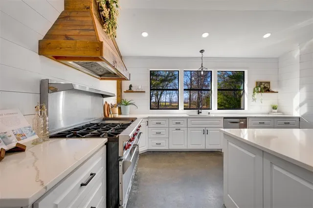 a kitchen with a stove and a sink
