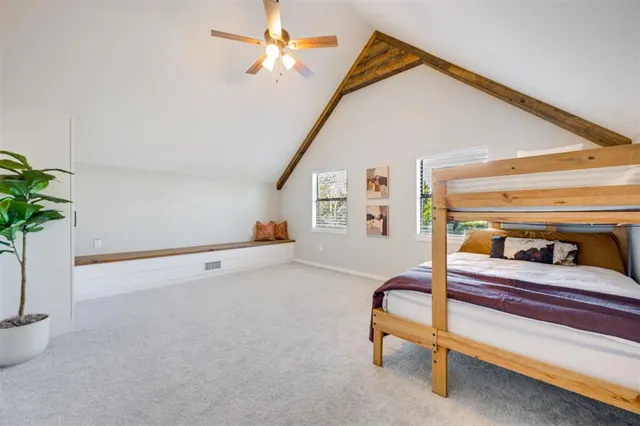 a bedroom with furniture and a potted plant