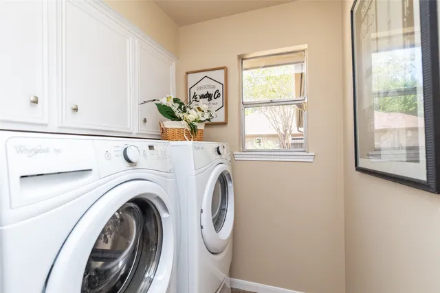 a utility room with dryer and washer