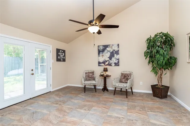 a view of a livingroom with furniture and a potted plant