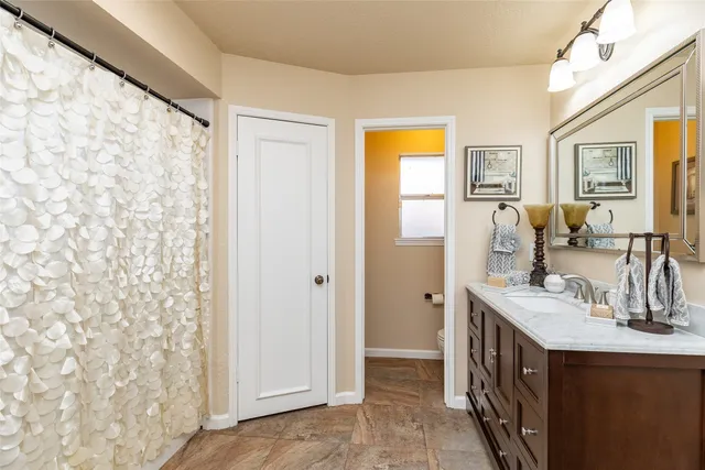 a bathroom with a double vanity sink mirror and