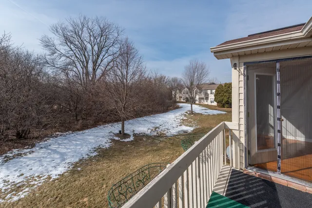 a view of balcony and yard