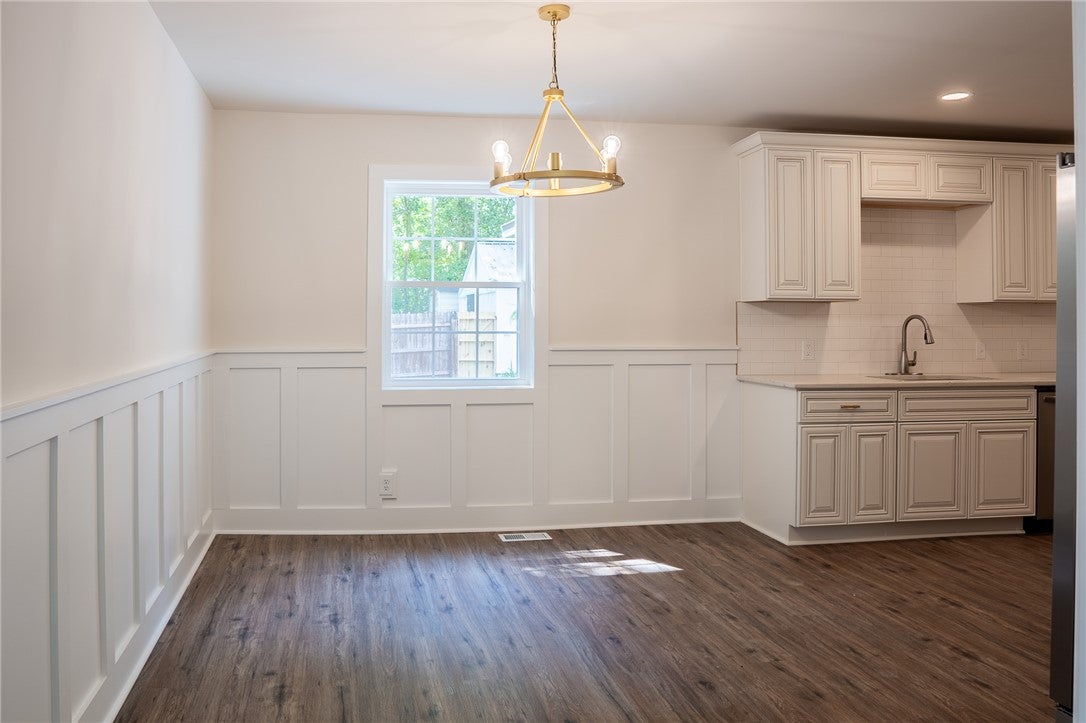 1312 Rocky Brook Road Opelika, AL 36801 - Photo 15 of 45 This bright dining area features elegant wainscoting and durable flooring.
