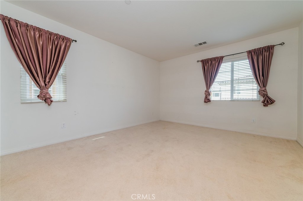 9361 Culinary Rancho Cucamonga, CA 91730 - Photo 17 of 45 an empty room with windows