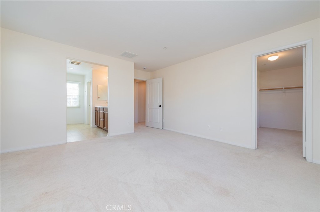 9361 Culinary Rancho Cucamonga, CA 91730 - Photo 19 of 45 a view of an empty room with a kitchen
