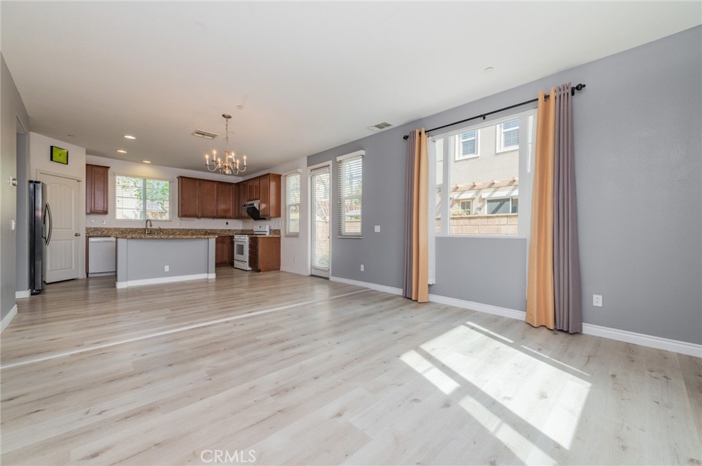 9361 Culinary Rancho Cucamonga, CA 91730 - Photo 20 of 45 a view of a kitchen with a sink and a refrigerator