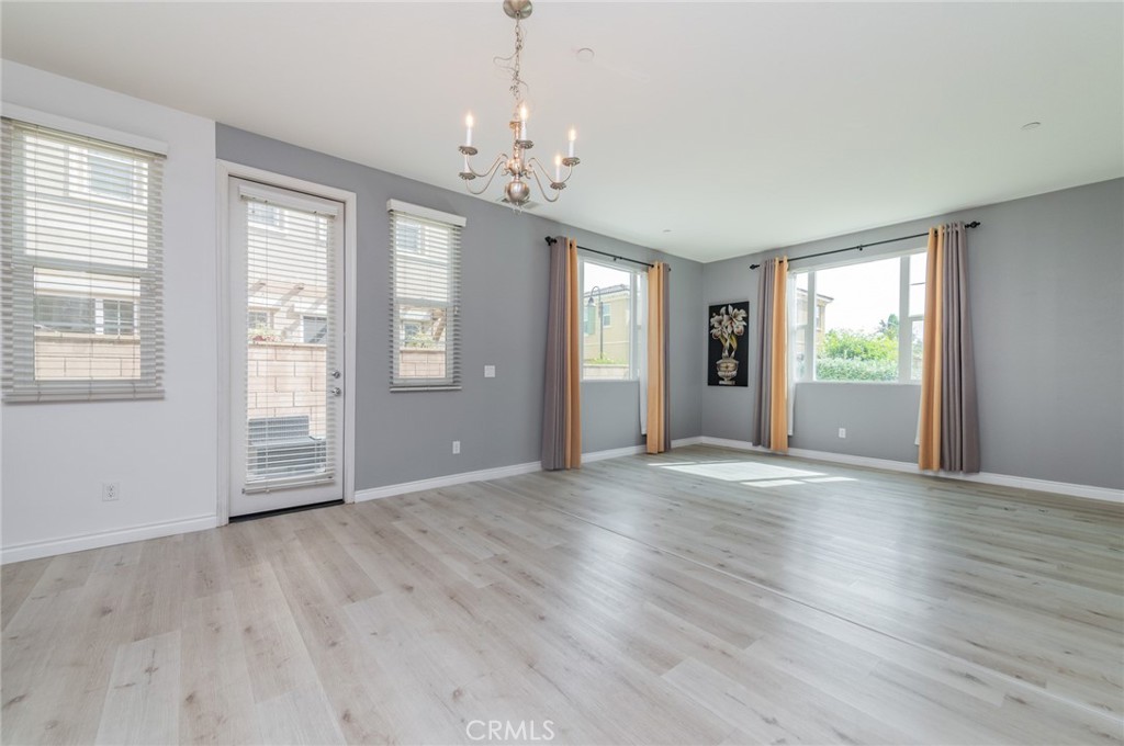 9361 Culinary Rancho Cucamonga, CA 91730 - Photo 21 of 45 a view of an empty room with wooden floor and a window