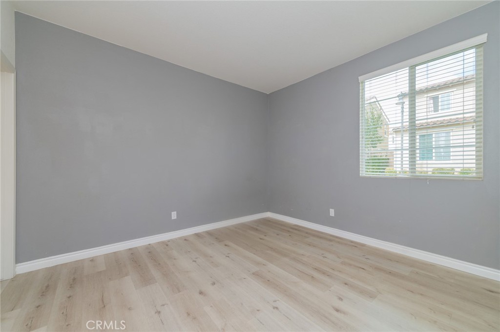 9361 Culinary Rancho Cucamonga, CA 91730 - Photo 28 of 45 a view of an empty room with wooden floor and a window