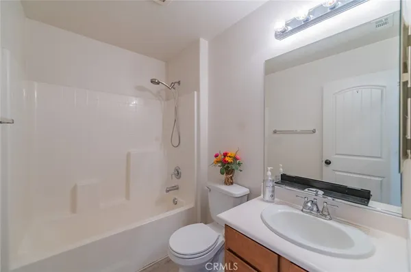 a bathroom with a sink toilet tub and shower