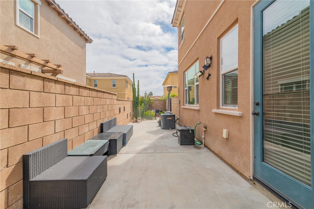 9361 Culinary Rancho Cucamonga, CA 91730 - Photo 31 of 45 a view of a patio with couches and fire pit