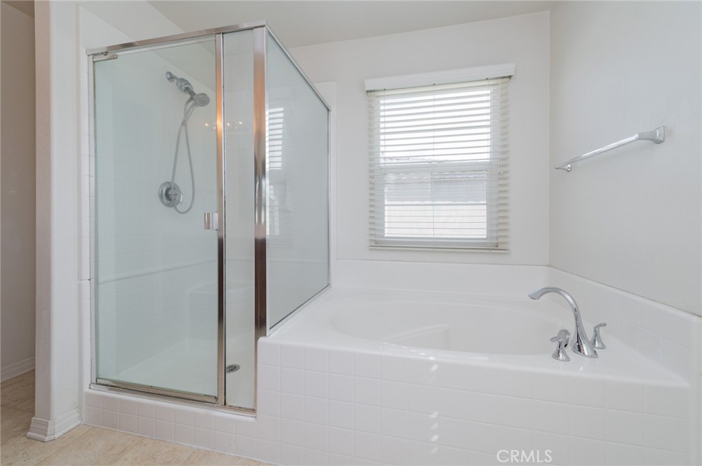 9361 Culinary Rancho Cucamonga, CA 91730 - Photo 7 of 45 a white bath tub sitting next to a shower