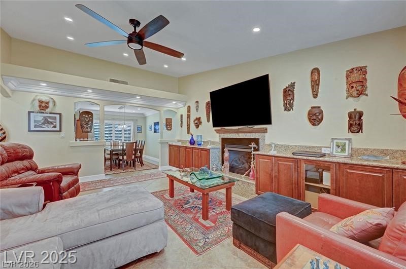 2410 Doherty Way Henderson, NV 89014 - Photo 15 of 63 Living area with ceiling fan, recessed lighting, baseboards, a fireplace, and light tile patterned floors